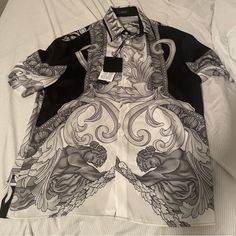 Nwt. Brand New. Never Worn. Boxy Fit. Xs, But Fits Small. Armhole To Armhole ~19.5. This Versace Shirt Features A Stunning Medusa Renaissance Square Design, Perfect For The Fashionable Man. The Shirt Is Made For Men And Is A Button-Up Type, Making It A Great Fit For Casual Occasions. The Brand Is Well-Known For Its Quality And Style, And This Shirt Is No Exception. Luxury Printed Tops For Formal Occasions, Luxury Summer Shirt With Graphic Print, Luxury Graphic Print Shirt For Summer, Designer White Printed Shirt, Designer Printed White Shirt, Designer Formal Printed Tops, Luxury White Summer Shirt, Designer Printed Tops For Formal Occasions, Elegant White Printed Tops