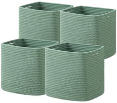 three green storage baskets sitting next to each other