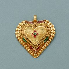 20 karat yellow gold handmade excellent tribal vintage look design handmade pendant amulet jewelry wedding jewelry from rajasthan india. Gold Purity- 20k yellow Gold Length - 2.7 cm approx Width - 2.4 cm approx Weight -  2.98 grams approx. Click here  https://morvijewels.etsy.com/ to get more discount and offers Happy to take wholesale bulk orders. for purchase string/tassel/cord please click the link below-  https://morvijewels.etsy.com/listing/1646921488  Please Note - We specialize in craftin Traditional Heart-shaped Jewelry For Festive Occasions, 22k Gold Temple Necklace Pendant For Festivals, Traditional Hallmarked 22k Gold Temple Necklace, Meenakari Temple Necklace Pendant For Puja, Meenakari Pendant Temple Necklace For Puja, Antique 22k Gold Meenakari Jewelry, Yellow Gold Pendant Temple Necklace For Festive Occasions, Gold Kundan Pendant Temple Necklace, Festive Yellow Gold Pendant Temple Necklace