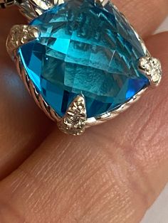 Used  David Yurman  Chatelaine Collection  Excellenet Condtion Specification : Estimated Retail : $1450-$1475 Weight: 12.9 grams can be rounded to 13 Gem: Blue Topaz checkerboard faceted  Ornament: Pave Diamonds near colorless estimated to be near 0.08 Siganture and Hallmark : Back of the ornament and on chain  Guarantee: 100% Warranty : 100% Collateral Pouch Very Good to Excellent Condtion Chatelaine, Necklace Blue, David Yurman, Pave Diamonds, Jamaica, Blue Topaz, Hallmark, Topaz, Diamonds