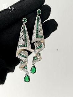 Exquisite earrings made of fine silk, embodying profound symbols and captivating stories. Each pair is meticulously crafted to embrace the essence of elegance and grace. Adorn yourself with these symbolic treasures, and let them whisper tales of beauty and enchantment.   -Brand: Thaya  -Material: Silver Gemstone Art, Lab Created Emerald, Art Earrings, Garnet Stone, Emerald Stone, Sapphire Stone, Silk Scarves, Blue Sapphire, 925 Silver