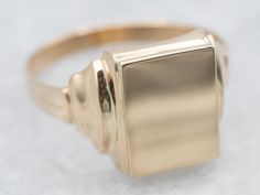 This signet ring is crafted from yellow gold and is the perfect way to make a statement. The timeless rectangular shape and simple design make this an ideal accessory for any style.Market Square Jewelers works with one of the finest hand engravers in the northeast. With over 30 years of experience, our engraver hand carves lettering, monograms, crests, or patterns in period-specific styles. Choose from our many monogram options shown in the listing or contact us directly with your own crest, or monogram, or for additional information, and pricing!Metal: 14K Yellow GoldTop Measurements: 8.1 x 10.5 mm, Rectangle Ring Size: 7Marks: "14K" Stamped on the inside band Timeless Wedding Signet Ring With Polished Edges, Classic Engraved Ring With Polished Edges, Classic Rectangular Signet Ring Stamped 14k, Elegant Rings With Rounded Edges For Formal Occasions, Elegant Formal Rings With Rounded Edges, Classic Signet Ring With Polished Edges, Refined Signet Ring With Polished Finish For Formal Occasions, Refined Polished Signet Ring For Formal Occasions, Timeless Engraved Ring With Polished Edges For Formal Occasions