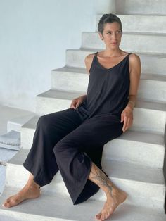 Cotton Ruched JumperOur loose-fitting lounge-ready jumpsuit is made from 100% cotton and will keep you cool and comfy on hot summer days. Adjust the wide legs by ruching them or wear them full-length. Layer one of our crop tops under it for extra style. We recommend hang-drying our 100% cotton. ColorsThis jumper is available in these colors: Matcha Camel Mangosteen Pacific Black Carbon Features: Adjustable shoulder straps Can be worn full or ruched to capri length Side pockets Size Suggestions: Relaxed Summer Jumpsuits And Rompers For Lounging, Solid Color Jumpsuits And Rompers For Summer Lounging, Solid Jumpsuits And Rompers For Summer Lounging, Comfortable Summer Loungewear Jumpsuits And Rompers, Comfortable Summer Loungewear Jumpsuits, Casual Wide Leg Jumpsuits And Rompers For Loungewear, Casual Wide-leg Jumpsuit For Loungewear, Comfortable Summer Jumpsuits And Rompers For Loungewear, Summer Jumpsuits And Rompers With Relaxed Fit