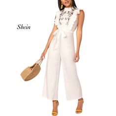 Shein White Mock Neck Ruffle Trim Embroidery Belted Palazzo Jumpsuit Nwot Size S. Please See All Pictures. Approximate Flat Lay Measurements Shoulder To Shoulder 12” Armpit To Armpit 16” Length Shoulder To Waist 15” Waist Side To Side 13” Inseam 24 1/2” Length Waist To Leg Bottom 40” *Couldn’t Locate The Fabric Tag. * It Is Suggested That All Items Be Cleaned And/Or Steamed Prior To Wearing. *Color May Vary Due To Lighting. *Pet Friendly Home. C1 Embroidered Cotton Jumpsuits And Rompers For Spring, Casual Embroidered Jumpsuits And Rompers For Spring, Elegant Cotton Jumpsuits And Rompers For Spring, Spring Embroidered Fitted Jumpsuits And Rompers, Embroidered Fitted Jumpsuits And Rompers For Spring, Sleeveless Embroidered Jumpsuits And Rompers For Summer, White Flowy Romper, Trim Embroidery, White Mock Neck