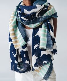 Forget what you know about flowery scarfs — this graphic wrap is a forget-me-not. It's a lightweight staple that makes a perfect warm-weather signature. Dimensions: 30" X 80" Fabrication: 76% cotton, 24% linen Summer Floral Print Patterned Scarves, Summer Cotton Scarf With Floral Print, Spring Floral Print Patterned Scarf, Spring Green Cotton Scarves, Green Cotton Scarves For Spring, Spring Floral Print Beach Scarves, Blue Cotton Summer Scarves, Blue Floral Print Scarves For Summer, Blue Scarves For Spring, One Size