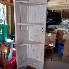 an open bookcase sitting in the middle of a room