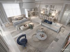 this is an aerial view of a living room with white furniture and decor on the walls