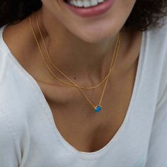 This delicate blue agate necklace is ideal for wearing alone or layered with other chains, making it a stylish everyday piece. Add a pop of color to your outfit with this elegant piece. Material: 925 silver plated with 18K goldGemstone: blue agatePendant size: 1.2*1cmChain length: 40+5cm Dainty Blue Necklace With Satellite Chain, Dainty Blue Necklaces With Satellite Chain, Blue Gold-plated Charm Necklace With Adjustable Chain, Elegant Blue Necklace With Satellite Chain, Blue Sterling Silver Necklace With Delicate Chain, Blue Necklace With Adjustable Chain For Layering, Dainty Blue Necklace With Delicate Chain, Blue Gold-plated Clavicle Chain Necklace, Blue Dainty Gemstone Necklace