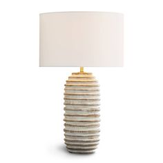 a lamp with a white shade on it