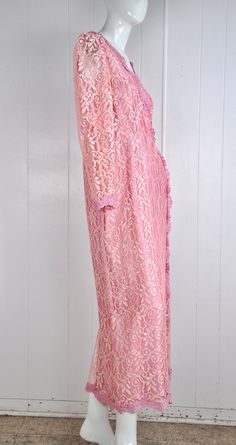 "A darling pink lace dress by JC Penney circa the 60s / 70s. It has little snaps at the sleeves, nape, and bust. There's a back zipper closure with a natural opening in the lace fabric to allow for the zipper to move. Made in the USA. Would suit a small or petite medium, but please see measurements below for accurate fit. CONDITION: Great gently worn condition. No flaws to note. MEASUREMENTS Bust: 38\" Waist: 30\" Length: 51\" Have a question? Please ask me anything." Pink Lace Dress For Wedding Guest, Pink Lace Dress For Formal Occasions, Pink Long Sleeve Lace Dress For Evening, Pink Lace Dress With Lace Patchwork For Formal Occasion, Pink Feminine Lace Dress For Wedding, Formal Pink Long Sleeve Lace Dress, Pink Evening Lace Dress With Lace Trim, Pink Lace Formal Dress, Pink Long Sleeve Lace Dress With Lace Patchwork