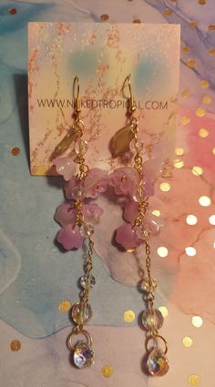 Beautiful purple flower, long dangle, crystal glass, colorful crystal glass, wisteria, gold chain, resin earrings, lightweight Pink 14k Gold Filled Dangle Jewelry, Glass Dangle Jewelry For Parties, Clear Dangle Jewelry For Party, Party Glass Dangle Jewelry, Crystal Long Drop Chandelier Earrings As Gift, Trendy Dangle Crystal Jewelry, Dainty Dangle Flower Earrings For Party, Trendy Gold Earrings With Dangling Beads, Pink Glass Party Jewelry