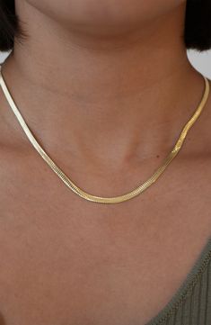 Simple and elegant on its own and stunning layered with other chains, this slender sterling silver or gold-plated necklace adds subtle shine to any neckline. 16 1/4" length; 2" extender; 1/8" band width Lobster clasp closure 18k-gold plate with sterling silver or sterling silver Made in Italy Classic Gold Snake Chain Necklace With Delicate Chain, Classic Gold Delicate Snake Chain Necklace, Elegant Gold-plated Herringbone Necklace, Gold Plated Clavicle Snake Chain Necklace, Classic Gold Herringbone Necklace With Delicate Chain, Elegant Gold Herringbone Necklace With Adjustable Chain, Everyday Gold Delicate Snake Chain Necklace, Elegant Gold Plated Snake Chain Necklace, Chic Gold Necklaces With Box Chain