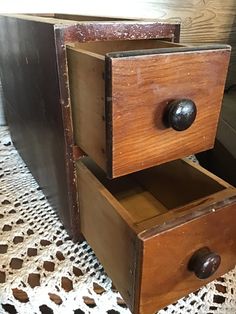 an old wooden drawer with two drawers