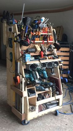 a wooden cart filled with lots of tools