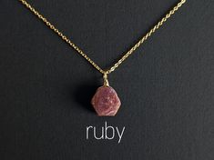 Delicate necklace with a raw ruby pendant. ♡ The ruby is lovingly hand-wrapped with a 925 sterling silver wire (silver version) or gold-filled wire (golden version). ♡ The stone length is between 10-12 mm. Since it is natural stone, the color & shape may vary. ⇻ᗰᗩTEᖇIᗩᒪS Wire: 14K gold filled (gold version) or 925 sterling silver (silver version). Chain: 18K gold plated (gold version) or 18K platinum plated (silver version). The base metal is copper. These are very high-quality chains whose plat Minimalist Ruby Jewelry As A Gift, Minimalist Ruby Jewelry As Gift, Handmade Ruby Necklace For Gift, Ruby Necklace With Natural Stones As A Gift, Ruby Necklace With Natural Stones For Gift, Spiritual Ruby Necklaces For Gift, Ruby Spiritual Necklaces For Gifts, Spiritual Gold Necklace With Ruby, Spiritual Ruby Necklace Gift