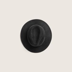 Hand made from soft 100% Australian wool, William Black is one of our most approachable and versatile wide brim styles. With a 6.5cm under welted rolled edge that can be worn up or down and finished with our signature embossed leather band accessory. It's the style that started it all and one of our favourite styles for both men and women. This hat is packable and ideal for travelling on your next adventure. Everyday Leather Fedora With Flat Brim, Classic Solid Color Felt Hat For Everyday, Everyday Leather Fedora With Curved Brim, Solid Curved Brim Fur Felt Fedora, Everyday Leather Fedora With Short Brim, Classic Black Fedora With Flat Crown, Black Curved Brim Panama Hat For Formal Occasions, Black Wool Felt Hat With Flat Brim, Formal Black Panama Hat With Curved Brim