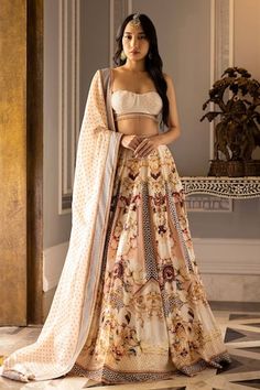 Ivory based, multicoloured lehenga with printed regal and floral motifs. The lehenga skirt is paired with a cropped blouse having crystals, sequins and tassels, and a bordered organza dupatta. - Aza Fashions Bohemian Lehenga With Sheer Dupatta For Wedding, Bohemian Wedding Lehenga With Sheer Dupatta, Bohemian Fitted Choli With Sheer Dupatta, Fitted Georgette Lehenga With Motifs, Bohemian Fitted Lehenga With Sheer Dupatta, Bohemian Fitted Lehenga In Georgette, Bohemian Fitted Georgette Lehenga, Bohemian Georgette Choli For Wedding, Bohemian Wedding Choli In Georgette