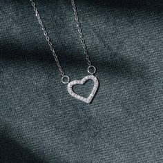 Crafted of .925 polished sterling silver, our Mini Diamond Heart Pendant offers a lovely look and is sure to go with your everyday style. It is suspended from a small rope chain that will definitely give you a sophisticated look. Klasē brings you the highest standard of jewelry. We fully warrant the authenticity of our materials and are pleased to offer our jewelry patrons a lifetime guarantee. Specifications Adjustable chain up to 18" Material Options Sterling Silver 14k yellow gold Heart Pendant Diamond, Mini Heart, Diamond Heart, Rope Chain, Everyday Style, Heart Pendant, Everyday Fashion, Silver Necklace, Yellow Gold