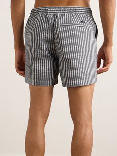 DESIGNED BY MR PORTER. Mr P.'s swim shorts are made from lightweight seersucker in a grey and white striped pattern. They're cut for a straight-leg fit and have a zipped fly and an internal drawstring waistband. Gray Cotton Beach Shorts, Summer Seersucker Bottoms For Vacation, Summer Seersucker Beach Shorts, Summer Beach Seersucker Bottoms, Gray Relaxed Fit Beach Bottoms, Seersucker Shorts For Summer Beach, Gray Beach Shorts For Summer, Seersucker Shorts For Beach In Summer, Summer Beach Seersucker Shorts