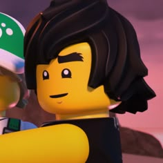 two legos are standing next to each other and one is wearing a green hat