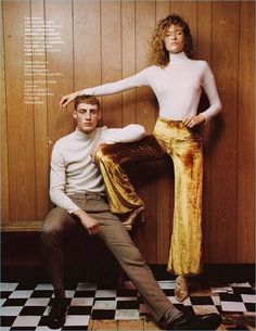 a man and woman posing for a magazine