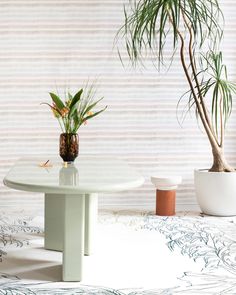 A coffee table with a Gradient Stripe Wallpaper Pink Island AND fabric on top of it Pink Island, Island Wallpaper, Nautical Colors, Nautical Pattern, Classic Wallpaper, Striped Wallpaper, Hand Knotted Rug, The Grove, Design Milk