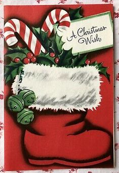 a christmas card with a santa's stocking and candy canes on it