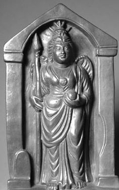 a statue is shown in black and white, with the image of a woman holding a staff