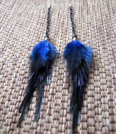 "These earrings were crafted using blue saddle feathers, black glass beads and black aluminum chain. About 8\" in length from the top of the surgical steel ear wires to the bottom of the feathers. Made to order. Please see my shop policies or shop announcement for current turn around time. If you need your order asap please let me know, I can usually accommodate rush orders. Check out the huge selection of feather jewelry and accessories in my shop! Please feel free to contact me for a custom or Adjustable Black Feather Jewelry, Black Feathered Jewelry For Festivals, Black Feather Jewelry For Party, Black Feathered Jewelry For Party, Elegant Blue Feather Earrings, Blue Feather Dangle Earrings, Adjustable Blue Feather Earrings, Blue Feather Earrings For Gift, Blue Feather Earrings As Gift