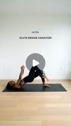 a woman doing a yoga pose on a mat in front of a white wall with the words, try this glute bridge variation