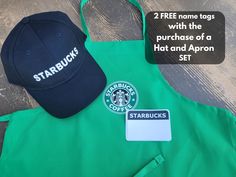 starbucks apron and hat sitting next to each other on a wooden table with text stating starbucks