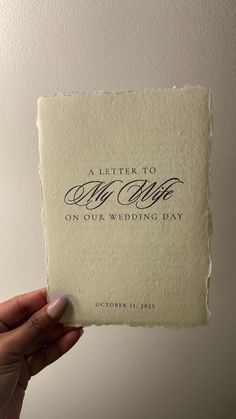 someone holding up a wedding card with the words, a letter to my wife on our wedding day