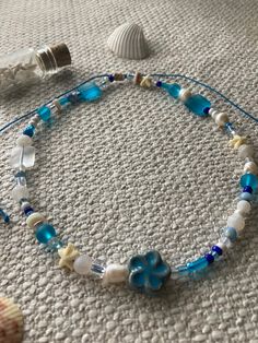 Mermaid Shores is a chunky beaded necklace strung on wax cord. It is adjustable and while water resistant, is not waterproof. Summer Beaded Necklace, Teen Summer Style, Ocean Necklace, Diy Collier, Beaded Necklace Diy, Beach Necklaces, Ocean Jewelry, Handmade Jewelry Tutorials, Mermaid Necklace