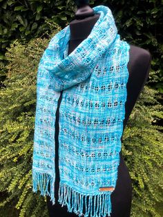 "Gorgeous handwoven scarf in a lace like pattern using a technique called Brooks Bouquet. The yarn is a hand dyed 4ply by Somerset Yarns in their Winter Wonderland colour way. It is 75% Merino and 25% Nylon. Handwoven in Edinburgh by me on my Ashford 20\" loom. Handwash only and dry flat. Approx dimensions: 186cm x 19cm (excluding fringe)." Blue Shawl Scarf For Gift, Blue Bohemian Handwoven Shawl, Handmade Blue Shawl For Winter, Traditional Blue Scarf As Gift, Blue Silk Scarf As Gift, Handmade Blue Yarn Scarves, Handmade Blue Yarn Scarf, Blue Handmade Bohemian Scarves, Blue Bohemian Handmade Scarves