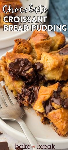 chocolate croissant bread pudding on a white plate with a fork next to it