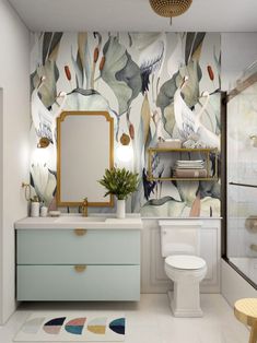 a bathroom with floral wallpaper and gold accents