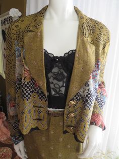 "80's/90's ladies jacket/skirt suit, by CACH'E, in a beautiful floral/honeycomb-like print, in colors of gold, black, blue, beige, brown rayon fabric. The shoulder padded floral lined Jacket is a size large to the waistline length, that buttons with three 1 1/2\" gorgeous gold metal rose shaped buttons. The Shoulders 18\", Length 20 1/2\", Waist 44\", Sleeves 25\". The Skirt in a size 12, with back nylon zipper, and one button closure, is in a slight fitted style, with Waist 28\", Hip 40\", Leng Fitted Fall Costume Sets, Fitted Costume Sets For Fall, Retro Party Sets For Spring, Vintage Fitted Long Sleeve Sets, Retro Fitted Sets For Fall, Vintage Blazer For Spring Party, Vintage Skirt Suit For Party, Vintage Tailored Skirt Suit For Spring, Tailored Vintage Skirt Suit For Spring