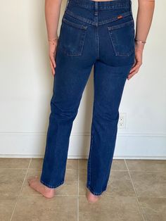 "Vintage 80s Rustler jeans in indigo wash denim, 100% cotton  Size 30 x 32  Fits a women's 28  Excellent condition  Measurements: laying flat  Waist: 15\"  Inseam: 32\"  Hips: 19\"" 90s Style Dark Wash Denim Flare Jeans, 90s Dark Wash Denim Flare Jeans, 90s Style Dark Wash Flare Jeans, Retro Jeans With Pockets For Everyday, 90s Style Rigid Denim Straight Leg Jeans, 90s Denim Blue Straight Leg Jeans, 90s Straight Leg Rigid Denim Jeans, Dark Wash Retro Mid-rise Jeans, 90s Style Straight Leg Rigid Denim Jeans