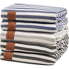 four folded towels stacked on top of each other