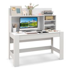 a white desk with a computer on it