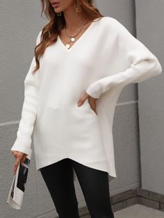 Our Clia Knit comes in an off white colour in an oversized drape fit. This features a heart neckline and open V back collar, batwing long fitted sleeves, and a roomy fit making this ideal for growing baby bumps. This piece is made from lightweight breathable material which is perfect for a trans-seasonal outfit. Pair with jeans for a lazy day outfit or complete the look with our Jady Rose Heels. Size Guide: Ambre is 5’2” tall, and has a 33.2” bust, 24.5”waist, & 36.7” hips. She is wearing a S / Chic White Long Sleeve V-neck Sweater, Chic White Batwing Sleeve Sweater, Oversized Cozy White V-neck Sweater, Oversized White Cozy V-neck Sweater, White Soft Knit V-neck Sweater For Layering, White Knit V-neck Sweater For Layering, Cozy Oversized White V-neck Sweater, White Oversized V-neck Sweater, White V-neck Sweater For Loungewear