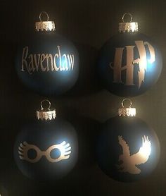 four harry potter christmas ornaments hanging from the ceiling in front of a window with their name on