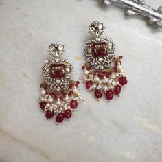 Ruby Red Drops Fine Kundan Chaandbali, Sabyasachi Jewelry, Moissanite, Indian Jewelry, Kundan Jewelry, Long AD Earrings, Bollywood Earrings Length: 3 inches Material: Stone, AD. Kundan Package: A pair of earrings High quality and craftsmanship, Designer jewelry. Free standard shipping If you have any questions or concerns please let me know. I'll be happy to answer them. Thank you so much for visiting our shop Luxury Red Kundan Chandbalis, Bollywood Earrings With Intricate Design For Reception, Bollywood Style Earrings With Intricate Design For Reception, Bollywood Style Intricate Earrings For Reception, Ruby Chandbali Earrings With Latkans, Heavy Ruby Chandbalis, Bollywood Style Chandelier Earrings With Intricate Design For Reception, Bollywood Style Ruby Chandbali Jhumkas, Festive Bollywood Ruby Chandbalis