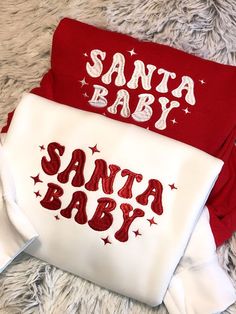 two red and white shirts with santa baby written on them