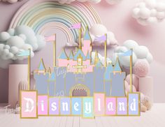 an image of a castle in the sky with clouds and rainbows behind it that says disneyland land