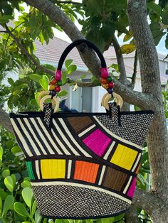 Handmade Colombian Bag/ Purse. Palm Base, Woven fiber, with Inner Lining and Pocket,  Zipper closure. Wood accesories. Length 12" x Width 17" (top) 13" (bottom)  Handle Length: 19" approx.  Elegance or fun in this versatile 'one of a kind' design. Lightweight, flexible, durable. We are proud to introduce you with a short story a Colombian artistry for today's women: For thousands of years The Zenu, one of the many ancestral cultures in Colombia, have developed a highly distinctive approach to ar Multicolor Hobo Bag With Braided Handles For Beach, Multicolor Shoulder Bag For Vacation, Large Capacity Multicolor Bags For Vacation, Vacation Multicolor Straw Shoulder Bag, Large Capacity Multicolor Vacation Bags, Multicolor Handheld Shoulder Bag For Summer, Multicolor Tote Bucket Bag For Vacation, Multicolor Large Capacity Straw Bag For Vacation, Multicolor Tote Bag For Vacation