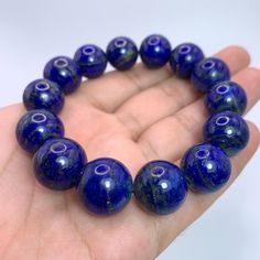 This Listing Is For Lapis Lazuli, The Photos Are Taken In Studio And Color Is Not Enhanced, If You Want Us To Take Photos In Natural Light Please Ask Before Purchase. DESCRIPTION: HAND MADE IN AFGHANISTAN BEST GIFT FOR FAMILY & FRIENDS SPECIFICATION: GEMSTONE TYPE:    Lapis Lazuli WEIGHT:                    98 Grams COLOR:                     Blue SIZE:                           16-17 mm Beads In Bracelet ORIGIN:                     Afghanistan QUANTITY:                One FINISH: Lapis Lazuli Round Beads Bracelets For Meditation, Lapis Lazuli Beaded Bracelets For Healing, Lapis Lazuli Beads With Natural Stones, Round Lapis Lazuli Beads With Natural Stones, Hand-strung Lapis Lazuli Beaded Bracelets, Healing Lapis Lazuli Beaded Bracelets, Polished Beads Lapis Lazuli Round Bracelets, Polished Beads Lapis Lazuli Bracelets, Lapis Lazuli Gemstone Beaded Bracelets