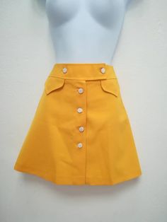 JO SKIRT Handmade skirt 100% Polyester Color: yellow You can choose your own measurements, color or length. You can choose lining, or other special request. Special request are easy, just add this listing to your cart https://www.etsy.com/listing/624364219/special-requests?ref=shop_home_active_25 If you want it on a rush you have priority shipping here, just add the one suits you the best to your cart https://www.etsy.com/shop/swingingchicksshop/items?ref=pagination&section_id=24952619 If yo 1960s Mini Skirt, 60s Skirt, Retro Skirt, Handmade Skirts, Yellow Skirt, 1960s Fashion, 60s Fashion, Suits You, Aesthetic Clothes