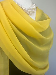 Elevate your style with our exquisite collection of chiffon shawls. Our chiffon shawls are the epitome of elegance and versatility, designed to effortlessly enhance your wardrobe and leave a lasting impression. Made from the fine poly chiffon fabric, these shawls offer a delicate and airy drape that adds a touch of grace to any outfit. Whether you're attending a special occasion, a casual gathering, or simply want to elevate your everyday look, our chiffon shawls are the perfect accessory. Choos Elegant Silk Dupatta Scarf For Wedding, Yellow Elegant Dupatta, Chiffon Silk Scarf For Weddings, Elegant Chiffon Dupatta In Traditional Drape, Elegant Dupatta Scarf For Wedding, Elegant Wedding Dupatta Scarf, Elegant Yellow Dupatta, Elegant Yellow Scarf As Gift, Elegant Yellow Scarves For Gifts