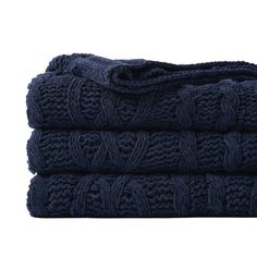 three blue towels stacked on top of each other